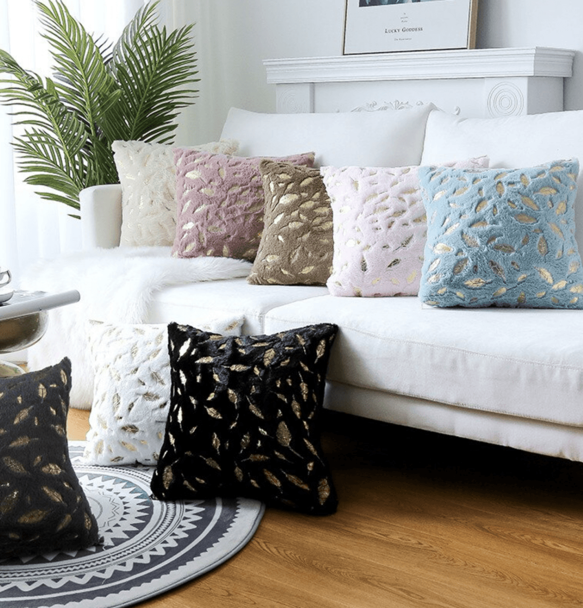 Dixie Plush pillows featuring soft velvet fabric and hand-painted gold decals, perfect for home decor.