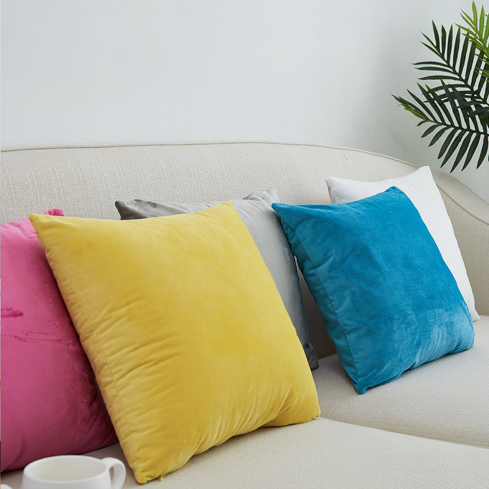 A collection of Dutch Velvet Cushion Covers in various colors, showcasing their luxurious texture and solid pattern, perfect for home decor.