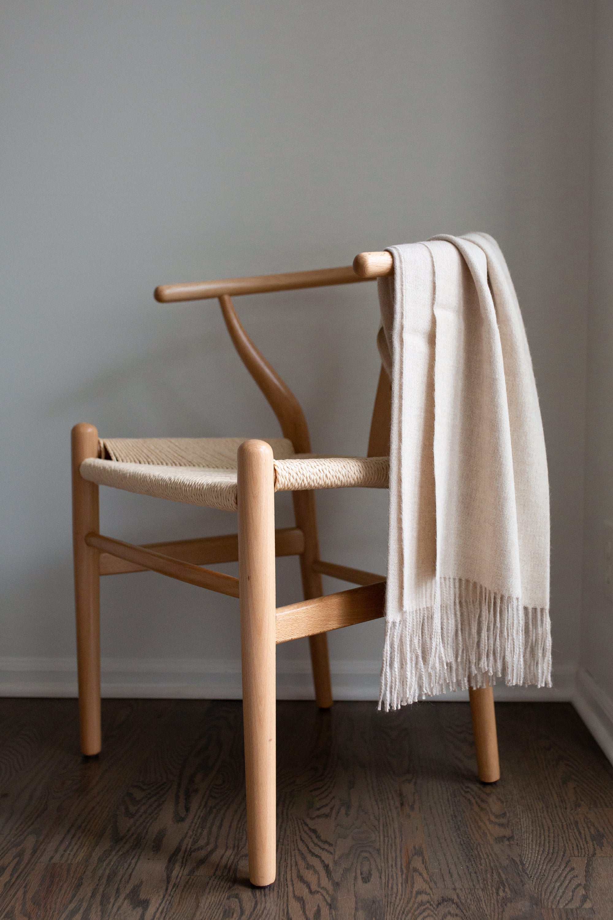 Encanto Alpaca Throw in Alabaster, showcasing its soft texture and elegant design, perfect for home decor.