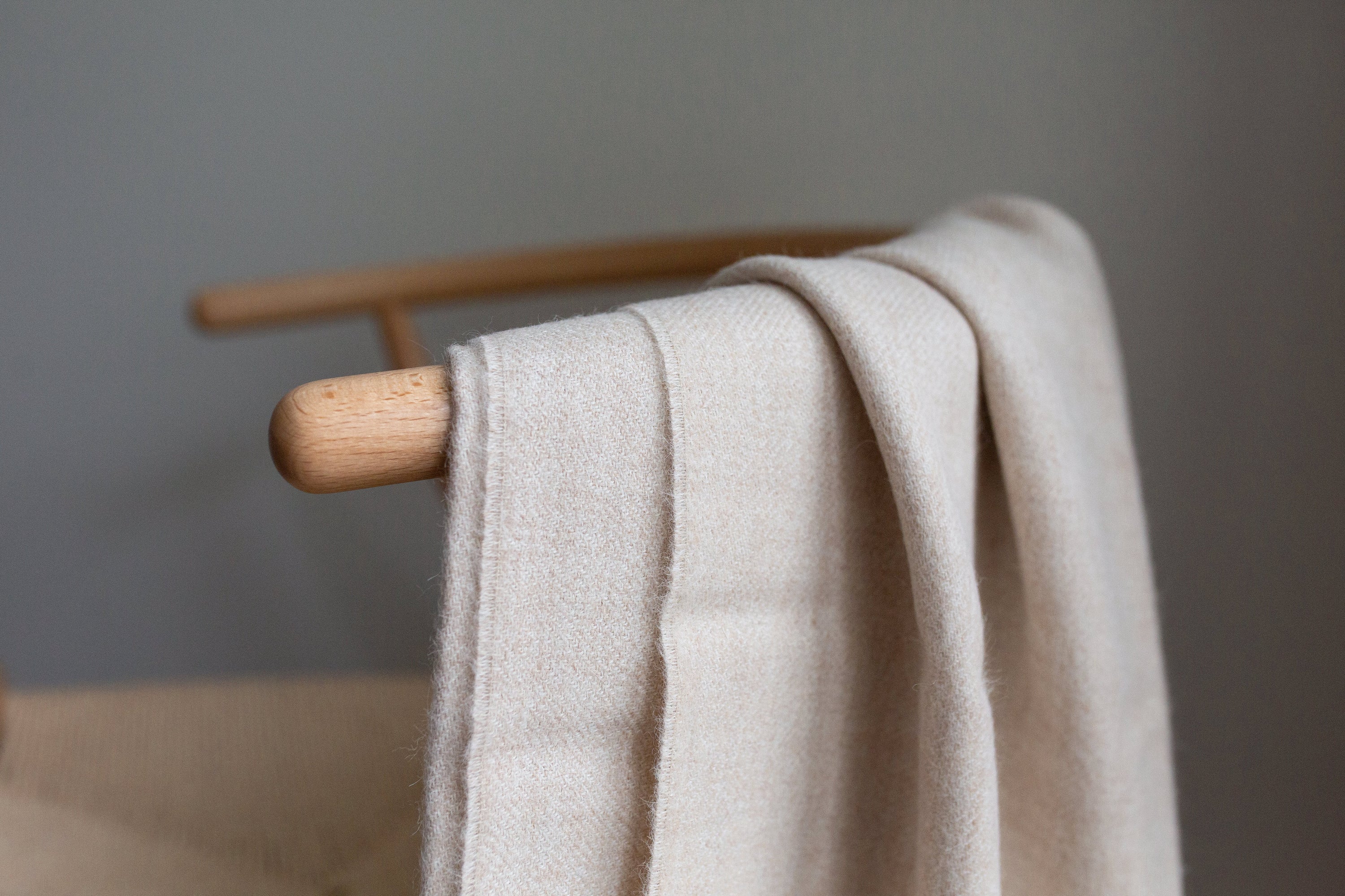 Encanto Alpaca Throw in Alabaster, showcasing its soft texture and elegant design, perfect for home decor.