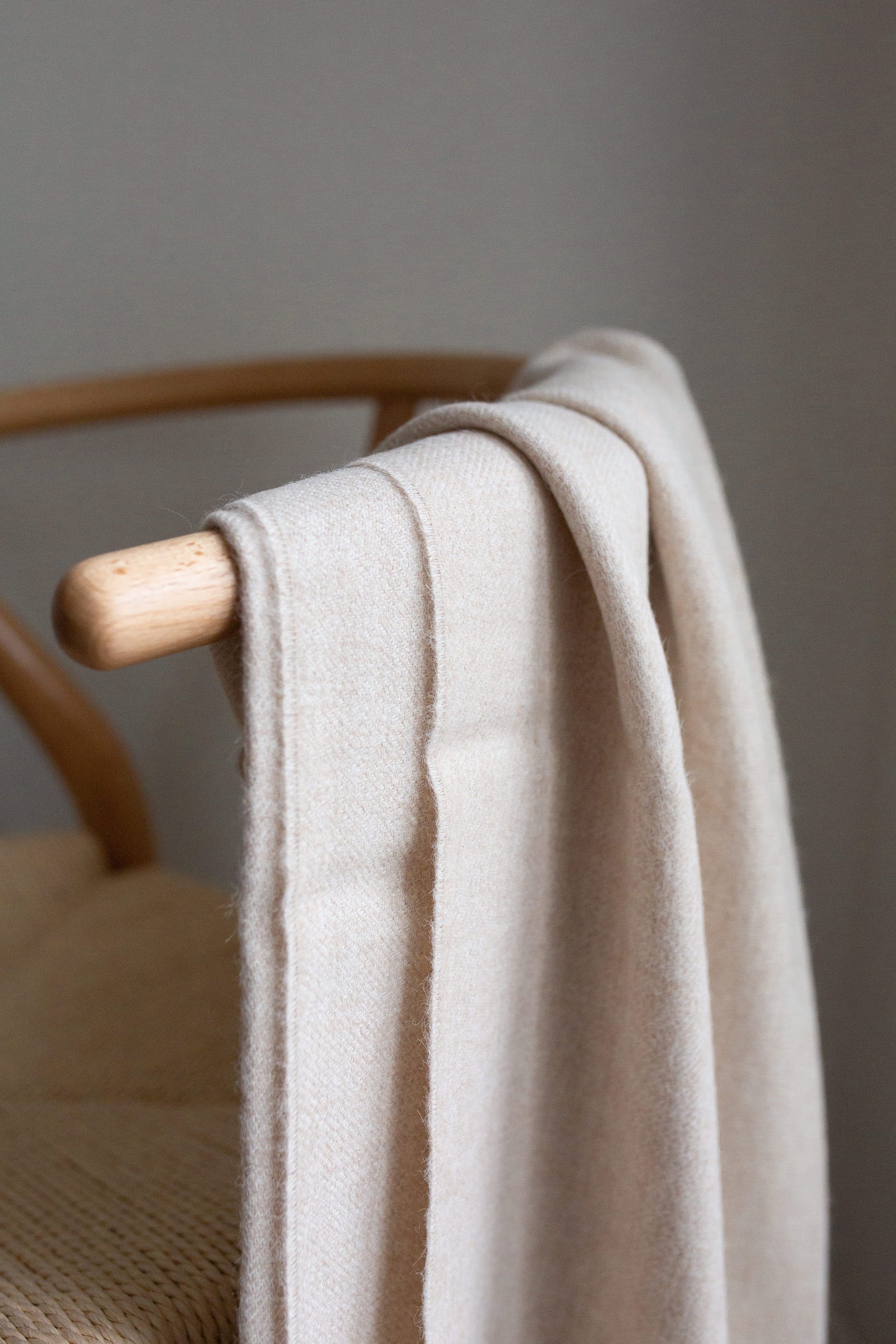 Encanto Alpaca Throw in Alabaster, showcasing its soft texture and elegant design, perfect for home decor.