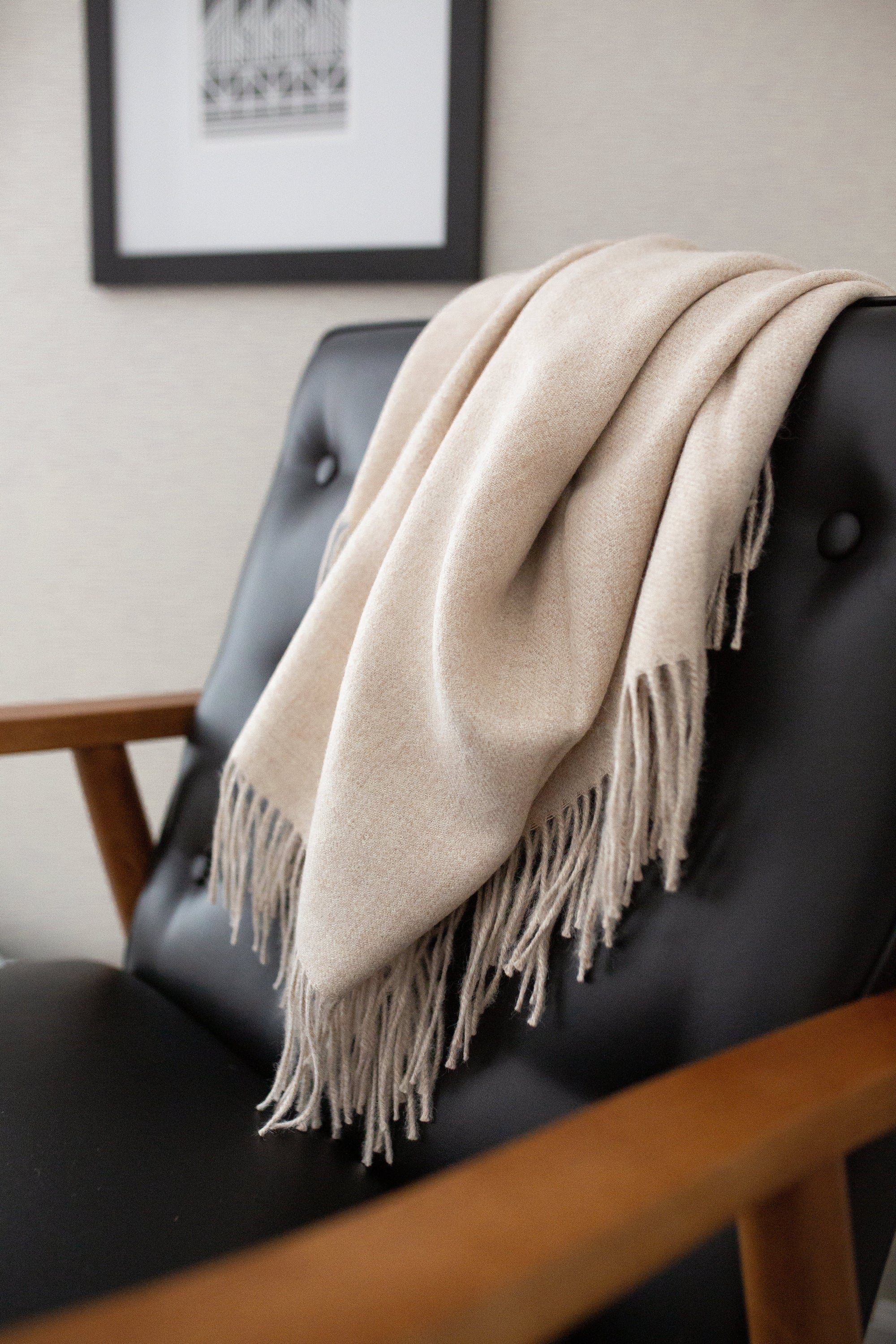 Encanto Alpaca Throw in Alabaster, showcasing its soft texture and elegant design, perfect for home decor.