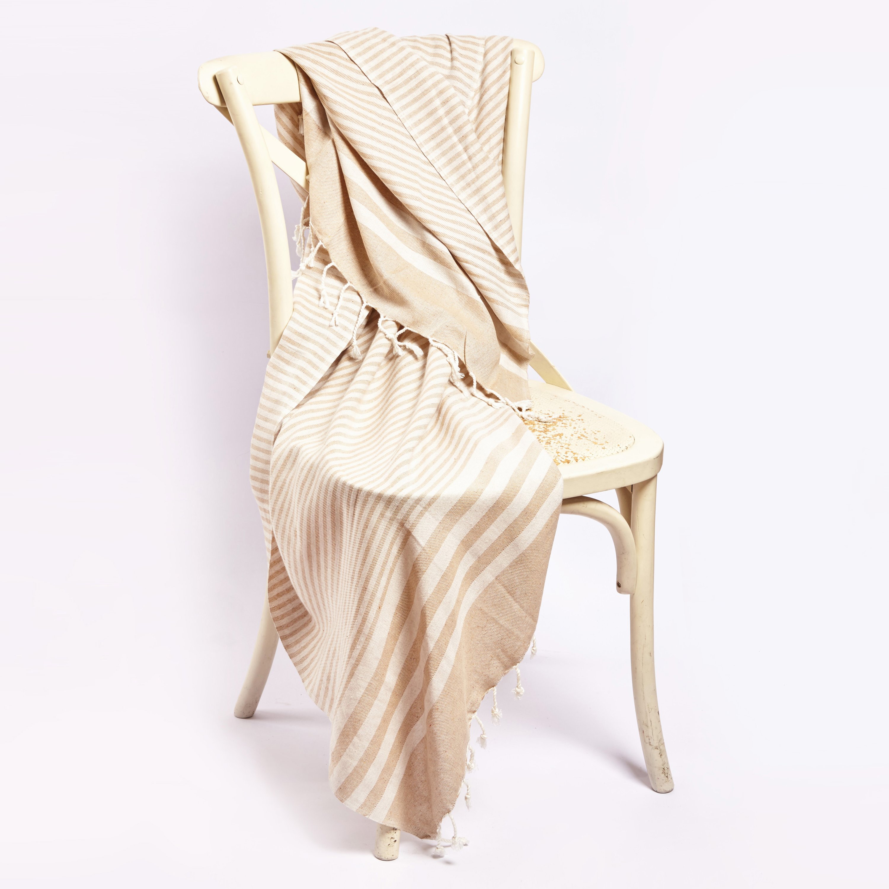 Fethiye Striped Throw Blanket in beige, showcasing its soft texture and stylish striped design, perfect for home or outdoor use.