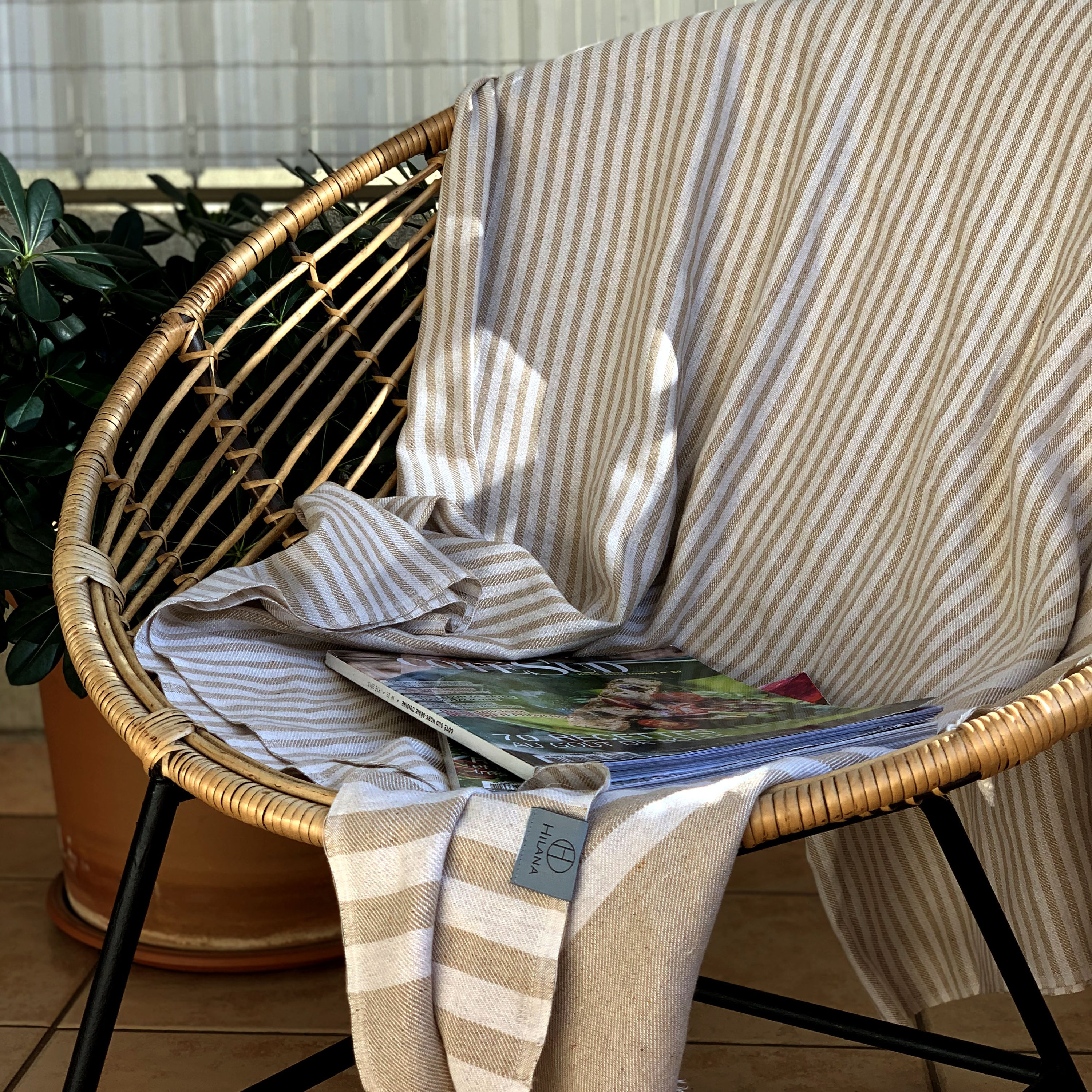 Fethiye Striped Throw Blanket in beige, showcasing its soft texture and stylish striped design, perfect for home or outdoor use.