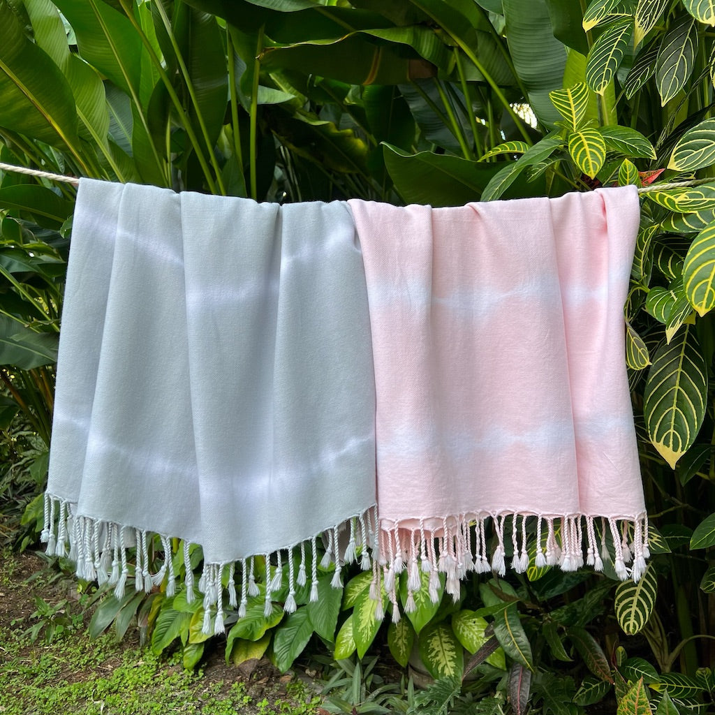 Gray Tie Dye Turkish Beach Towel made from 100% Turkish cotton, showcasing unique patterns and tassels, perfect for beach or bath use.