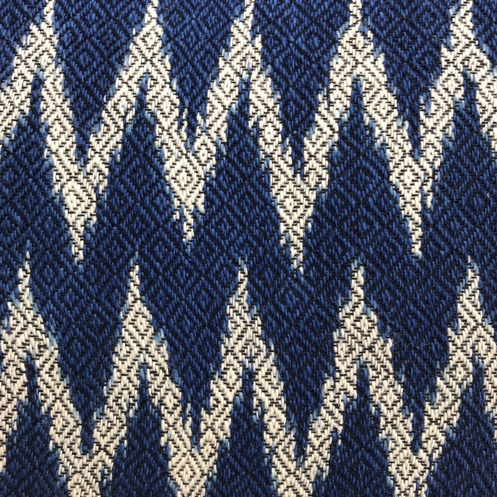 Handcrafted Indigo Chevron Pillow Cover made from natural indigo dyed cotton, showcasing unique patterns and craftsmanship.