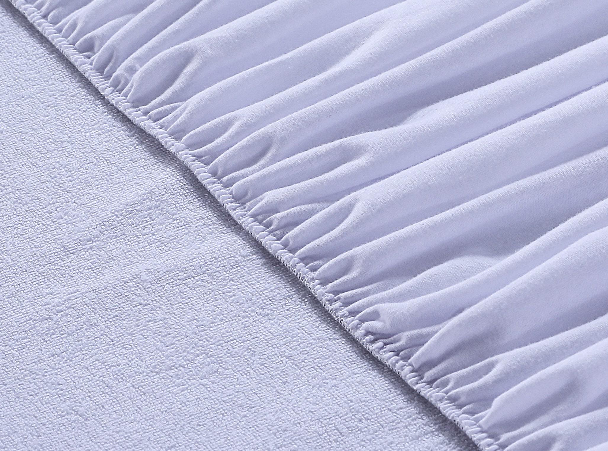 A soft, breathable 100% cotton mattress protector designed for comfort and protection, featuring a deep stretchable pocket for a perfect fit.