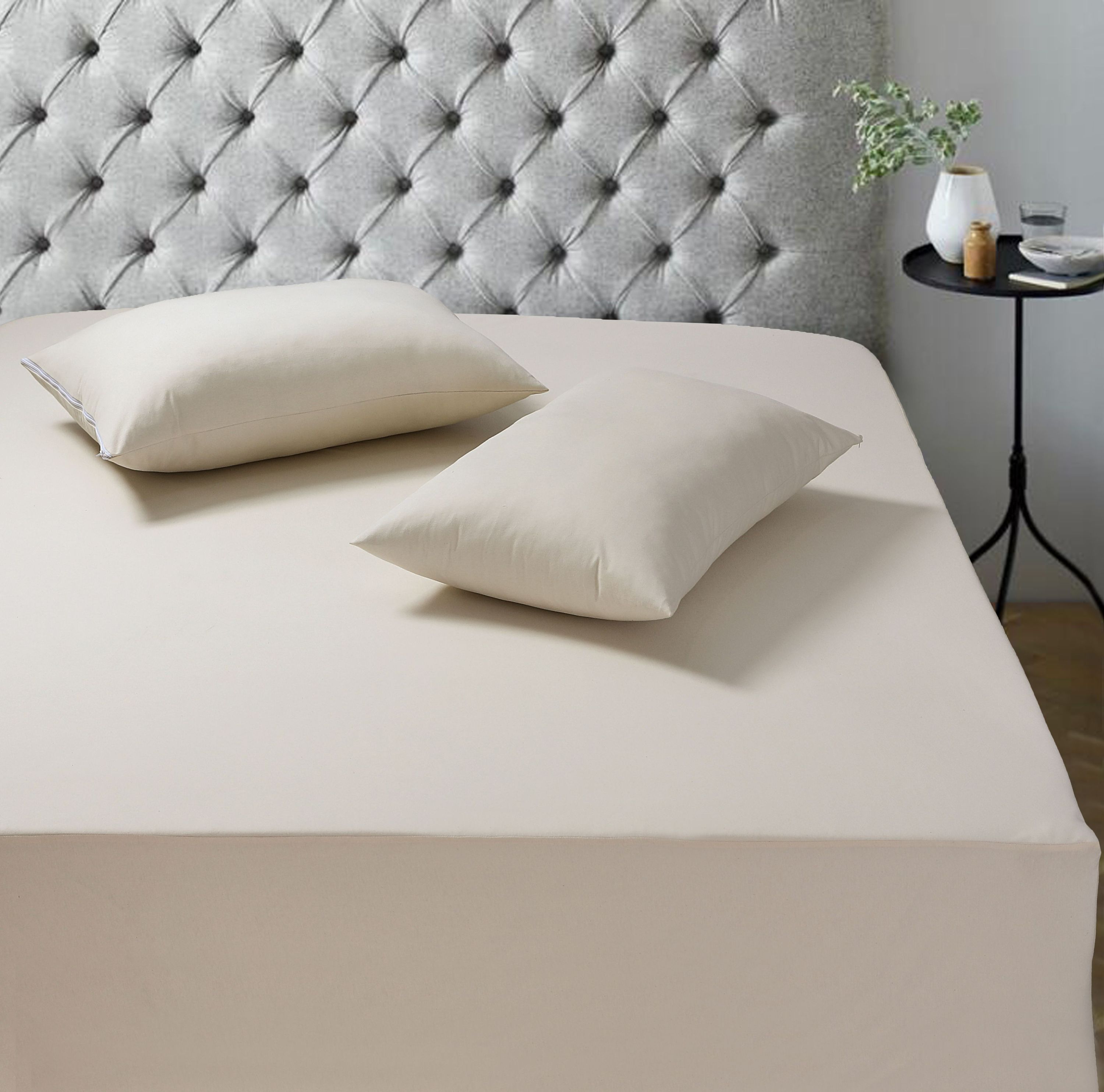 A soft, breathable 100% cotton mattress protector designed for comfort and protection, featuring a deep stretchable pocket for a perfect fit.