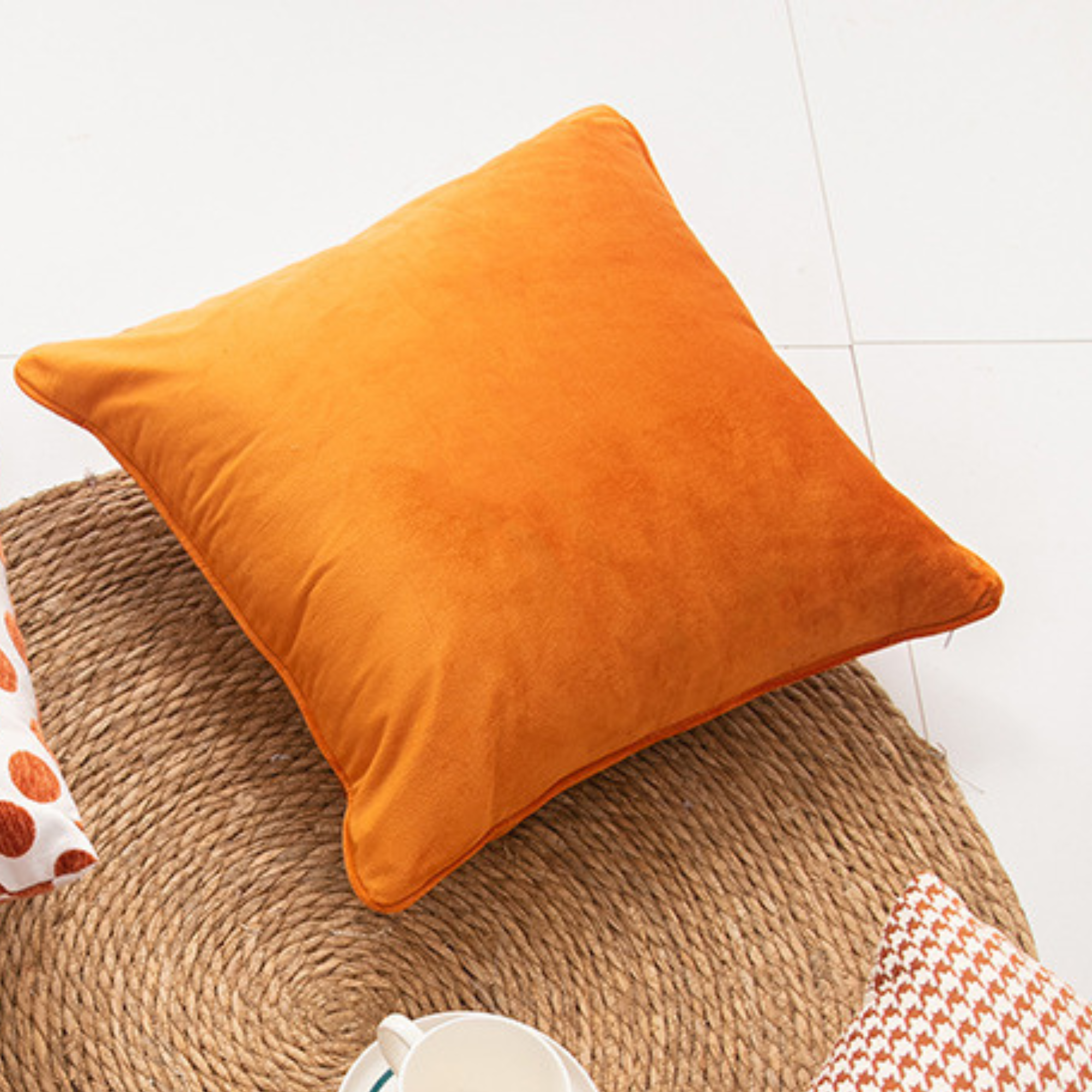 Multiple geometric pattern orange cushion cover, 45cm x 45cm, featuring chenille and velvet materials.