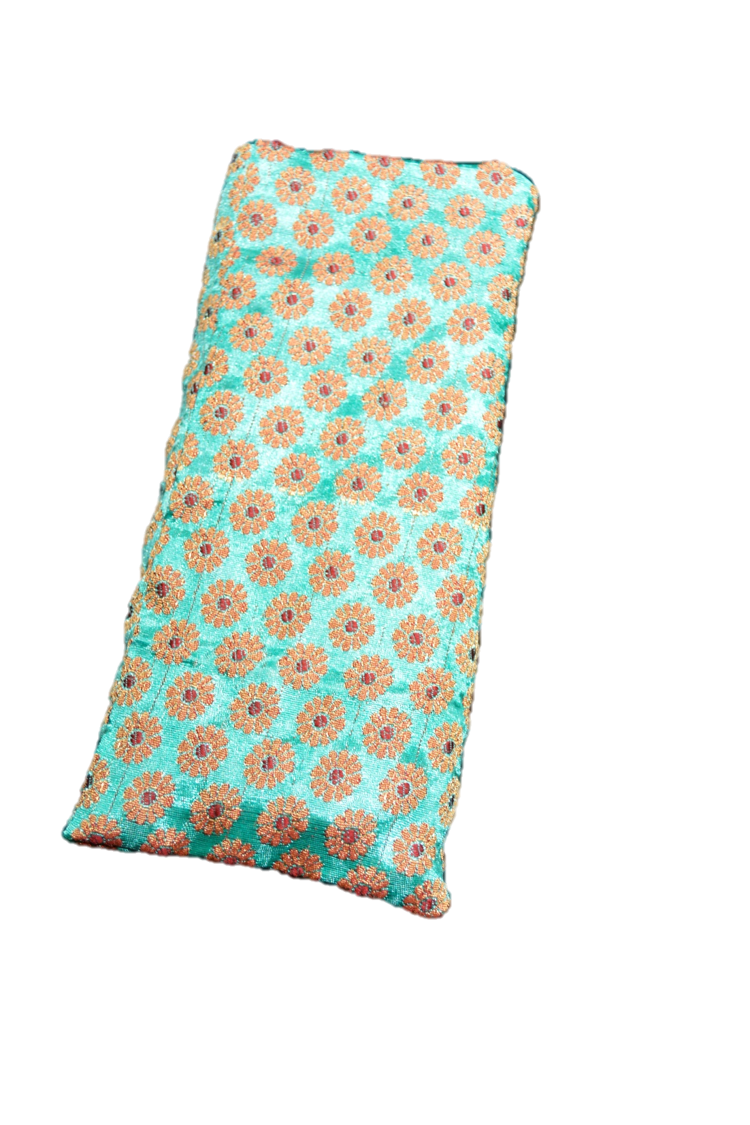 OMsutra Floral Silk Eye Pillow filled with natural flax seeds, featuring a beautiful floral design, perfect for relaxation and meditation.