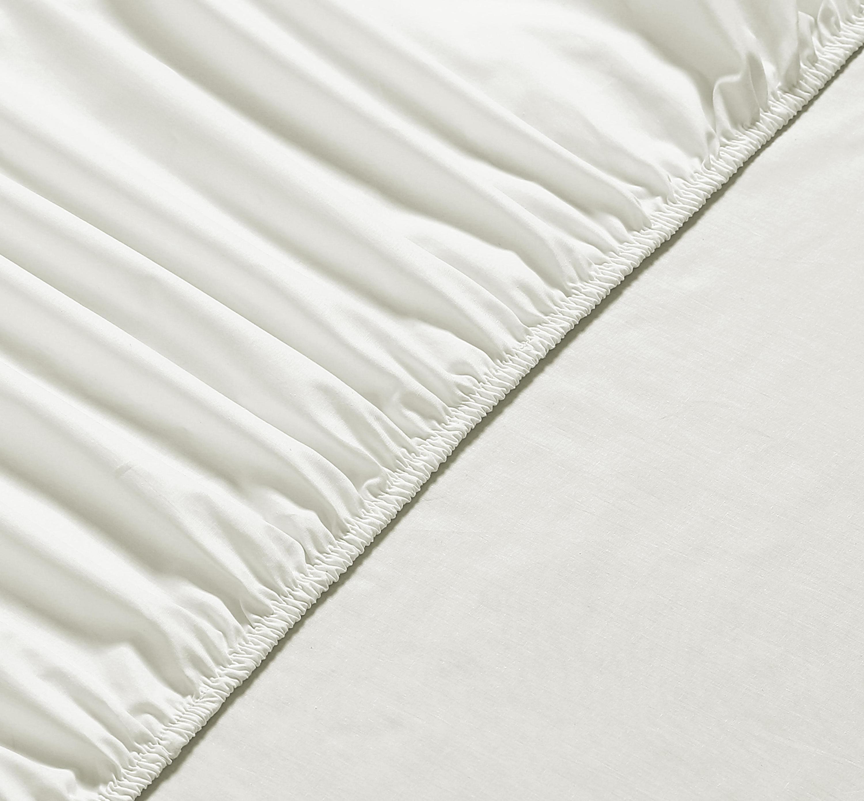 A crisp and lightweight Percale Fitted Sheet made from 100% cotton, showcasing its smooth texture and all-round elastic hem for a perfect fit.