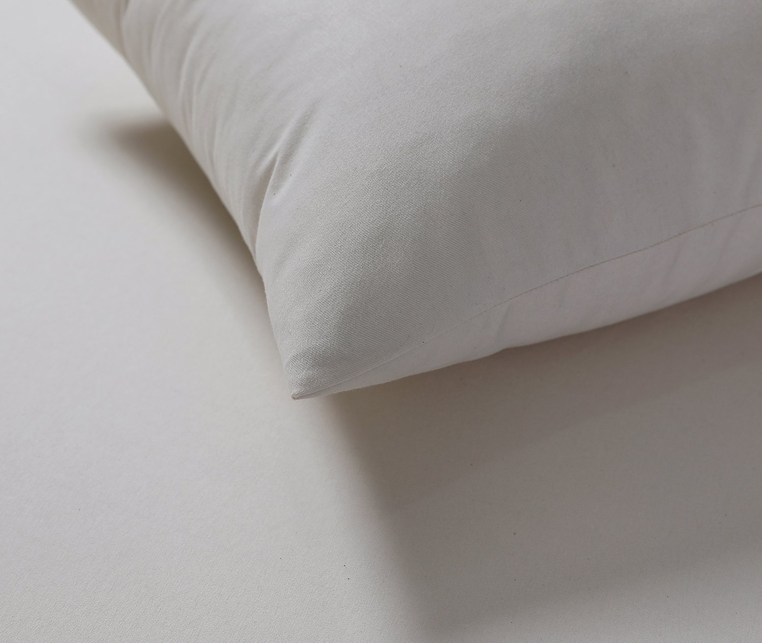 A set of soft, breathable pillow protectors made from 100% cotton, showcasing their water-resistant and allergen-friendly features.