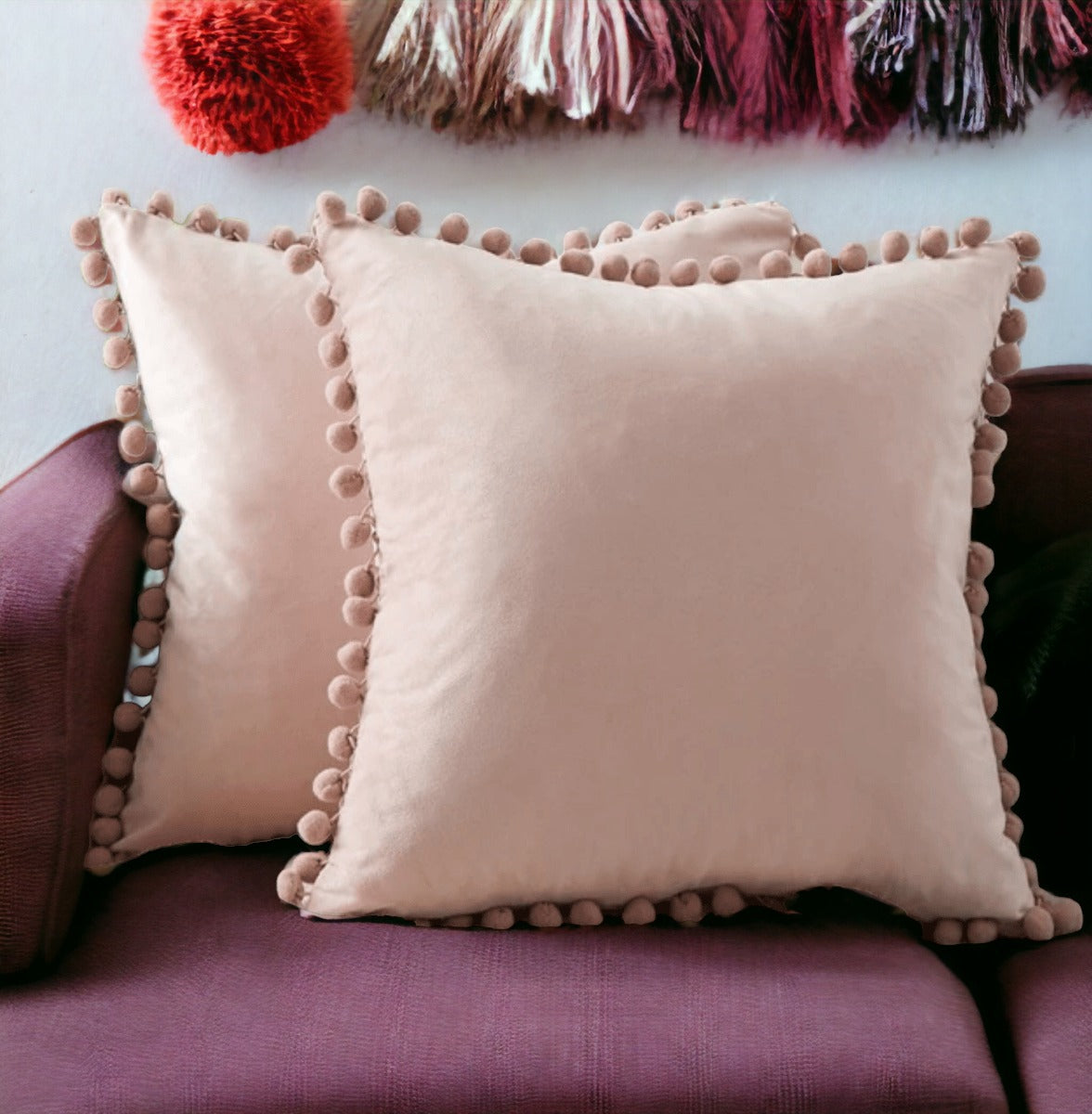 A cozy set of Plush Pom Poms pillows in soft velour material, perfect for cuddling or decorative use.