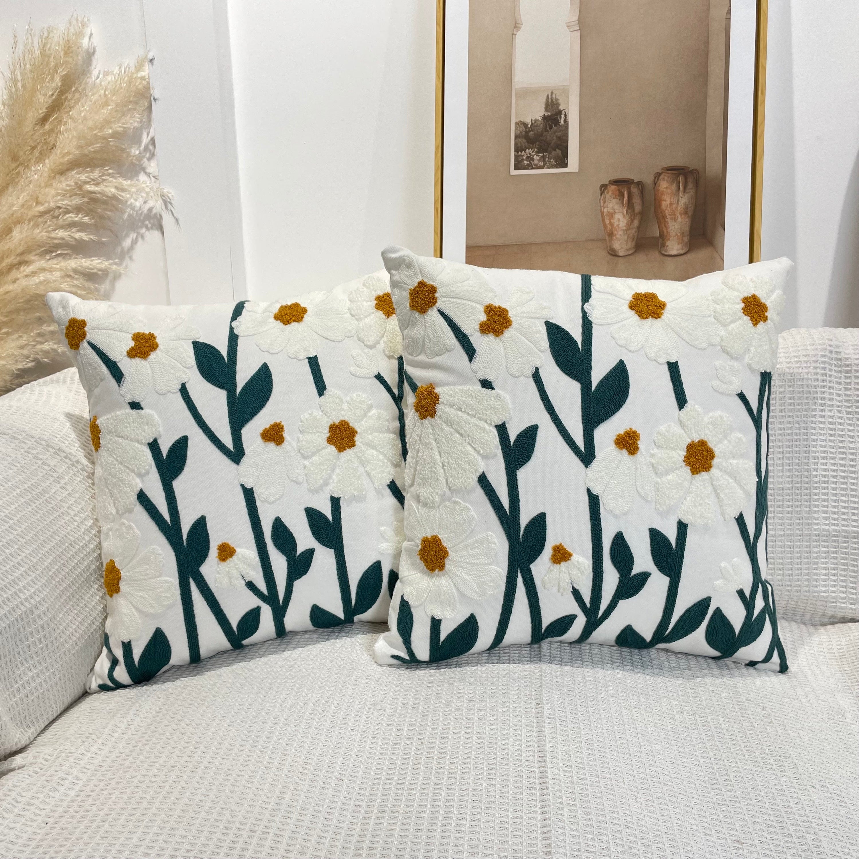 Pure cotton tufted cushion with flower pattern and tassels, perfect for home decor.