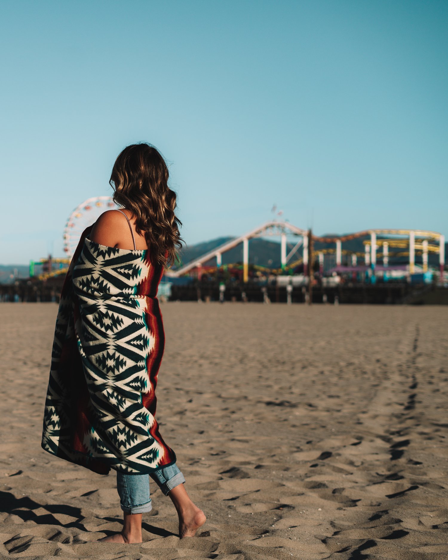 Quichua Blanket featuring vibrant colors and intricate patterns, handcrafted by Ecuadorian artisans, perfect for outdoor and indoor use.