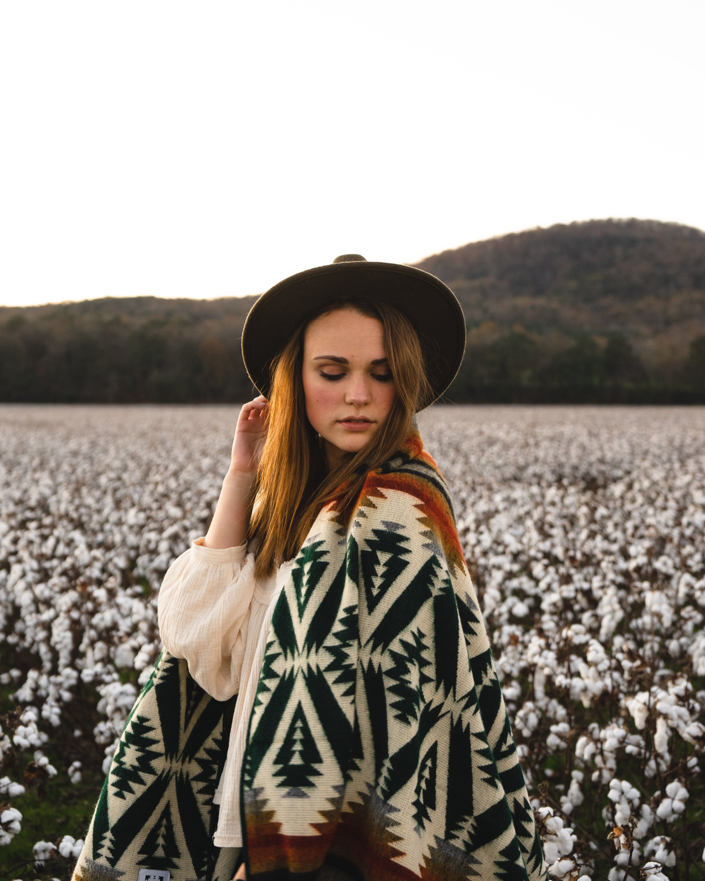 Quichua Blanket in Evergreen Autumn design, showcasing vibrant colors and intricate patterns, perfect for cozying up indoors or outdoor adventures.