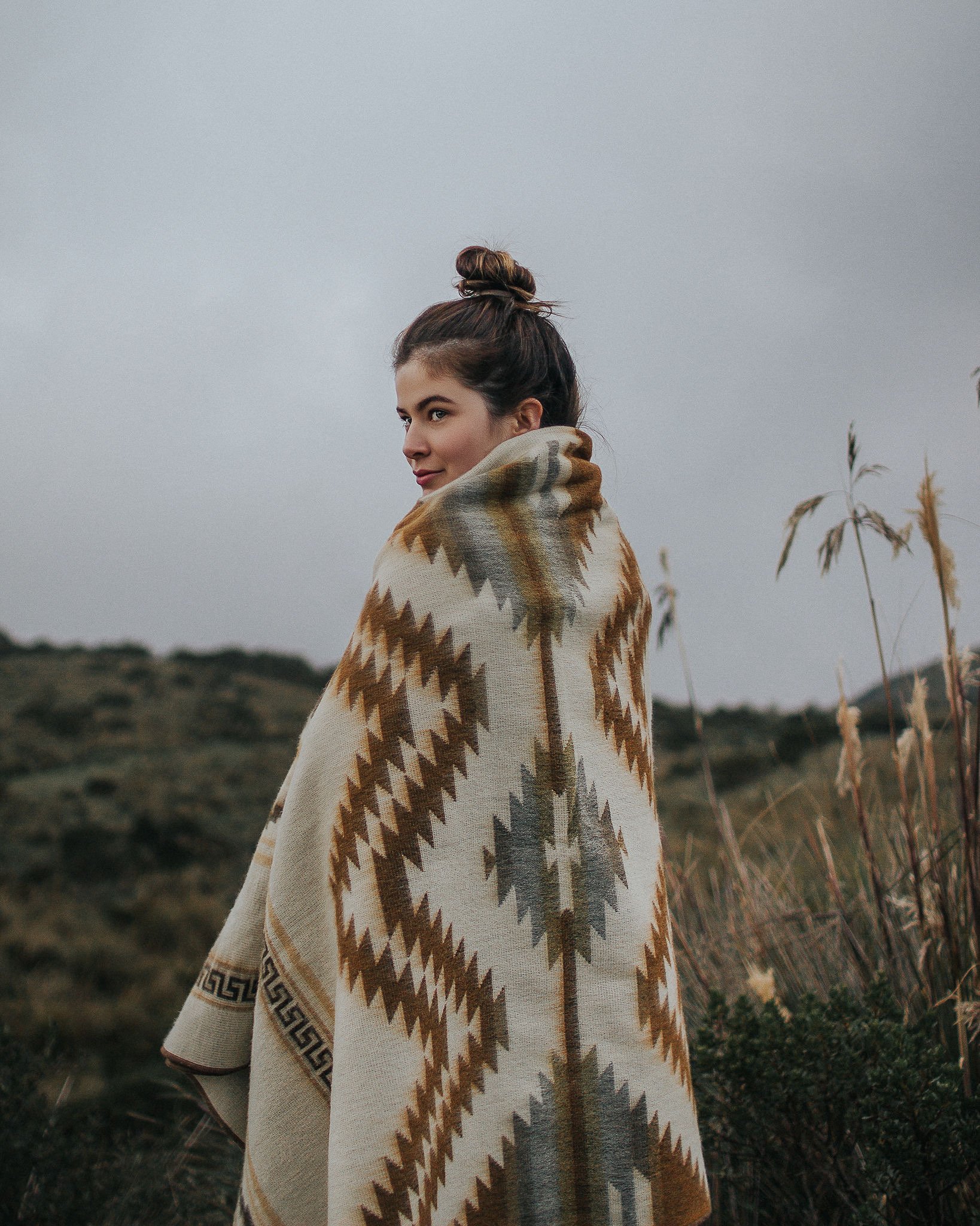 Shuar Blanket - Dusty, featuring vibrant colors and intricate patterns, handcrafted by Ecuadorian artisans, perfect for cozying up or outdoor use.