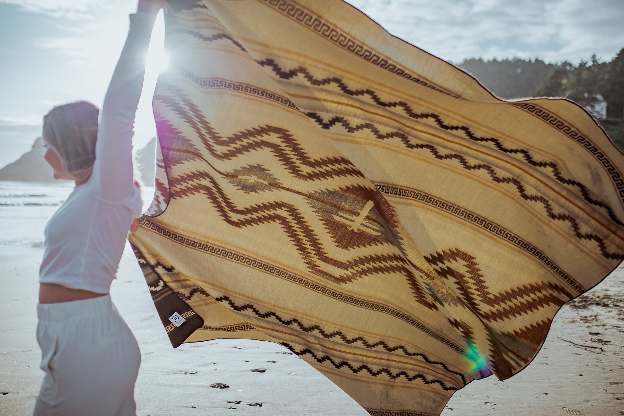 Shuar Blanket - Dusty, featuring vibrant colors and intricate patterns, handcrafted by Ecuadorian artisans, perfect for cozying up or outdoor use.