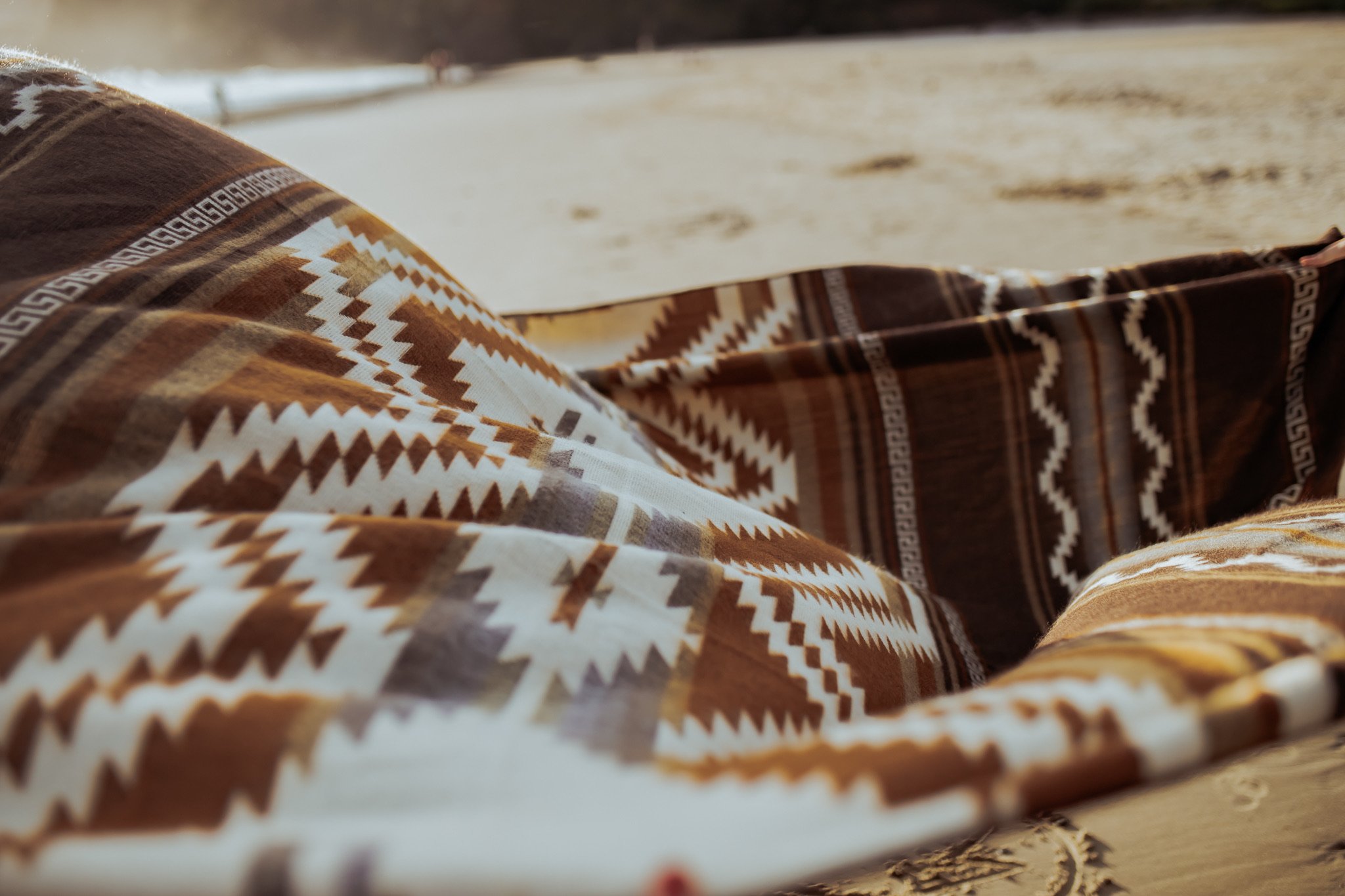 Shuar Blanket - Dusty, featuring vibrant colors and intricate patterns, handcrafted by Ecuadorian artisans, perfect for cozying up or outdoor use.