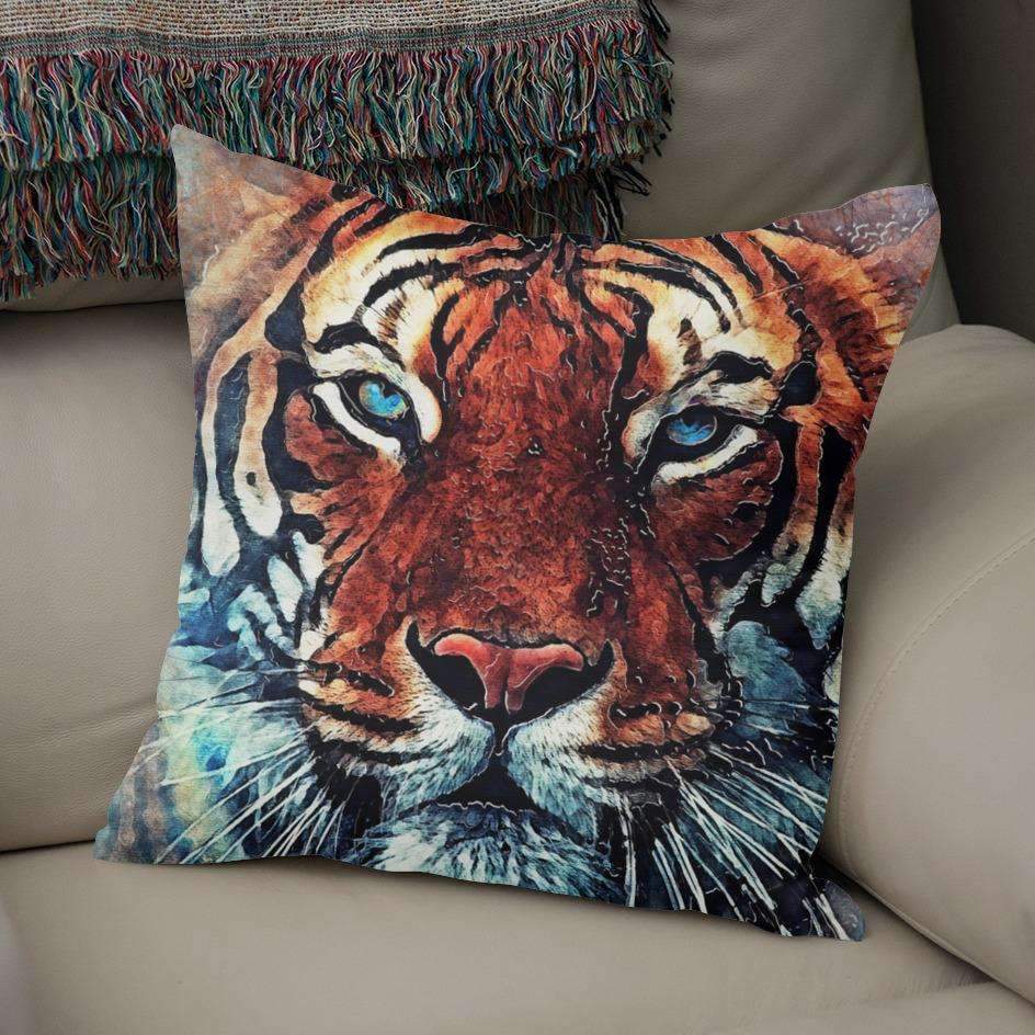 A luxurious Tiger Pillow designed by Saadana Shanmukam, featuring a vibrant tiger print on both sides, made from 100% spun polyester with a concealed zipper.