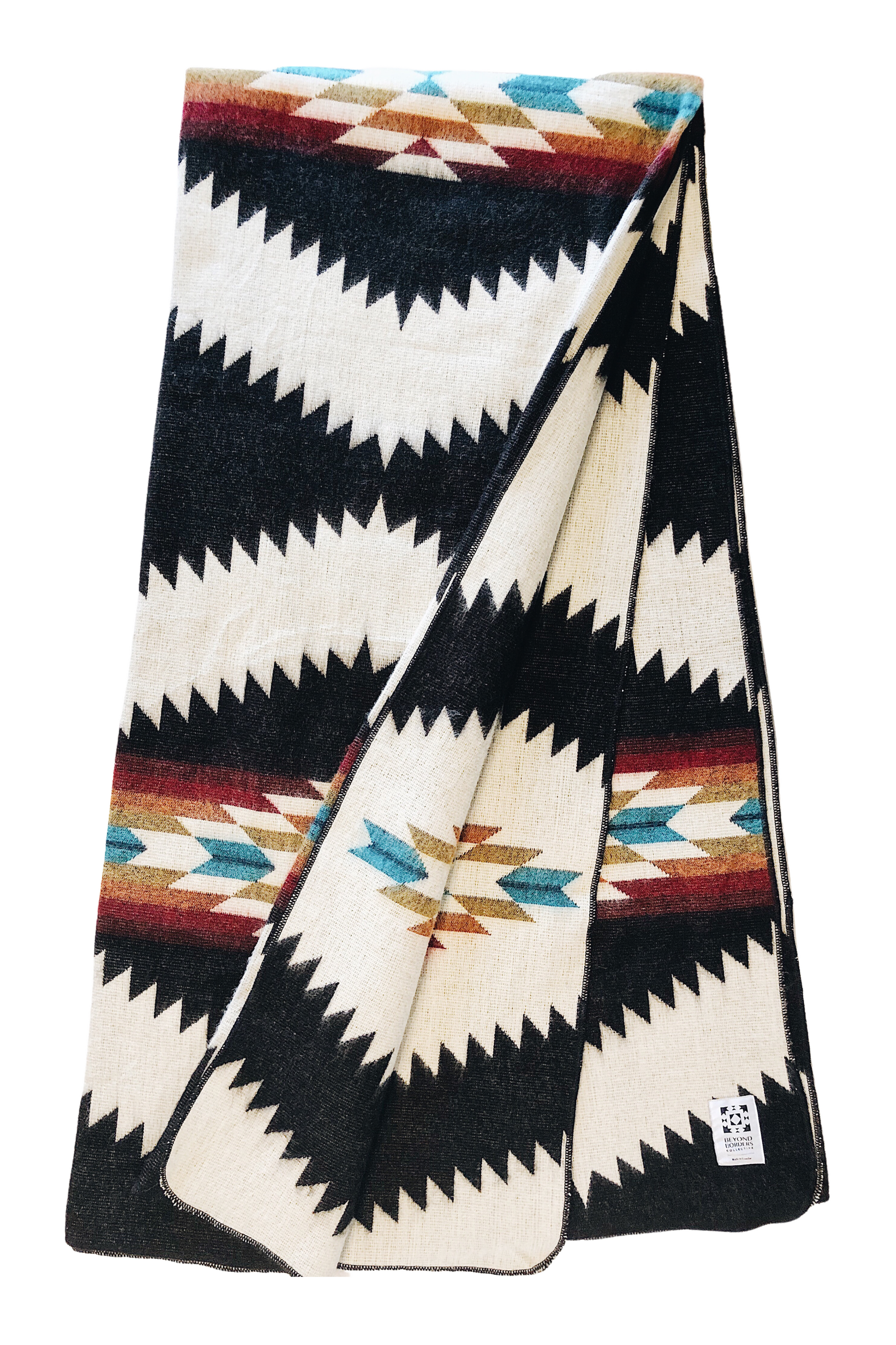 Tsachila Blanket in Colorful Black, showcasing vibrant patterns and soft texture, handcrafted by Ecuadorian artisans.