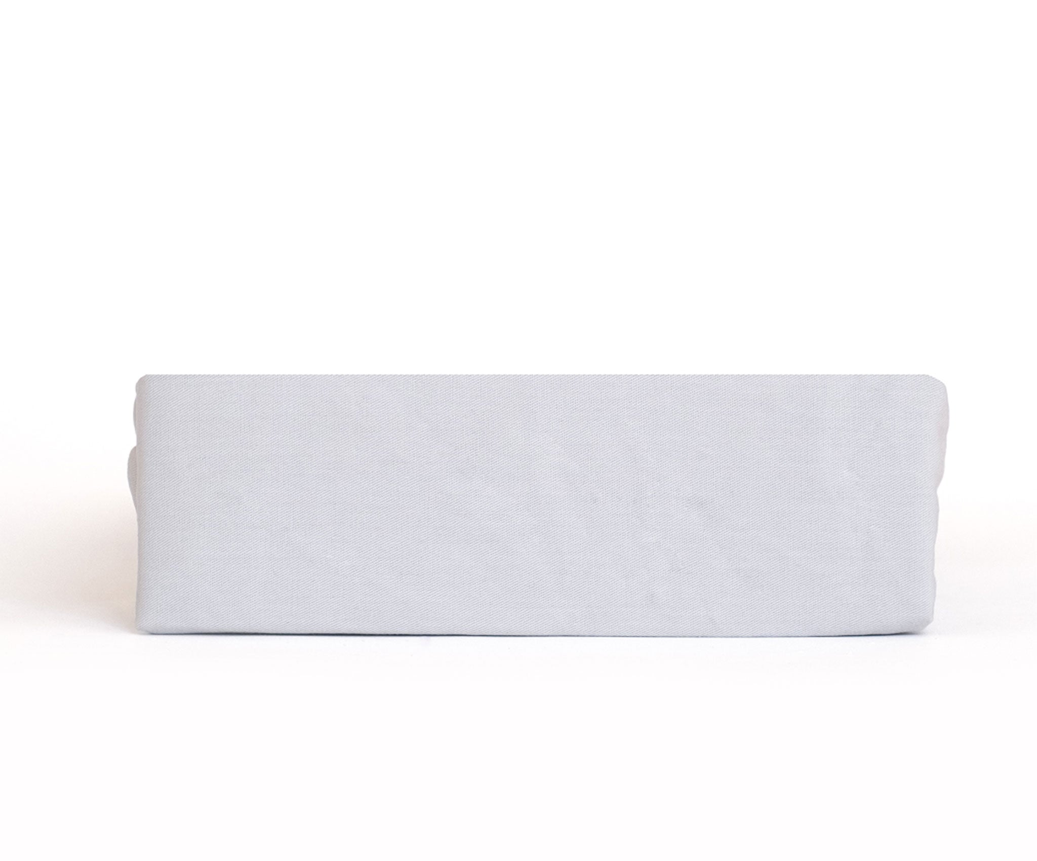 A Twill Fitted Sheet showcasing its durable twill weave and non-slip rubber backing, available in various colors.