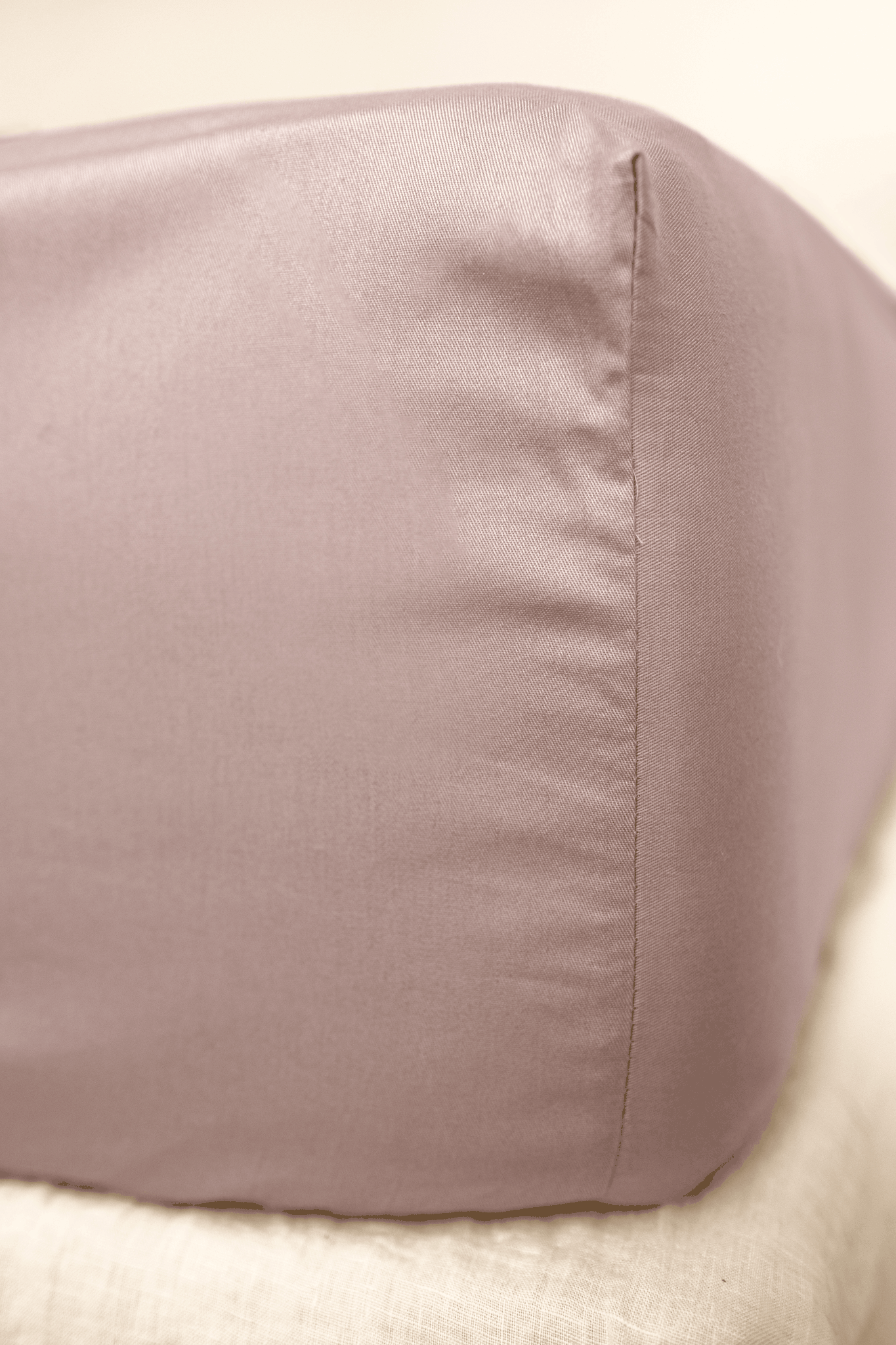 A Twill Fitted Sheet showcasing its durable twill weave and non-slip rubber backing, available in various colors.