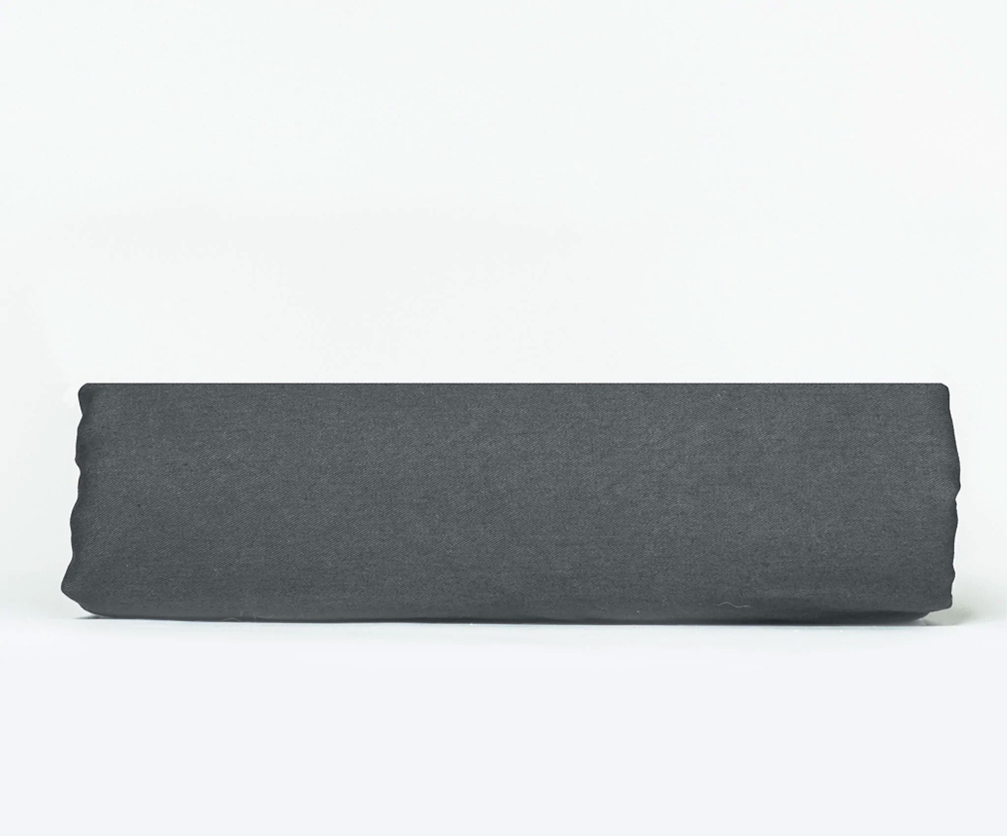 A Twill Fitted Sheet showcasing its durable twill weave and non-slip rubber backing, available in various colors.