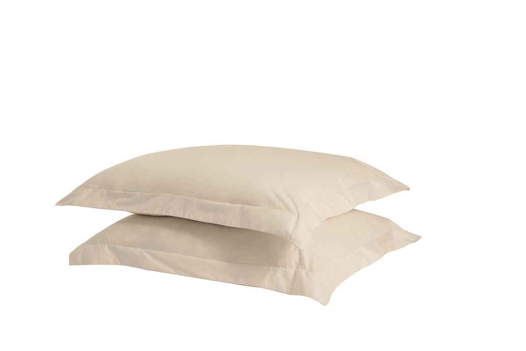 A set of two twill weave cotton pillowcases in various colors, showcasing their soft texture and durability.