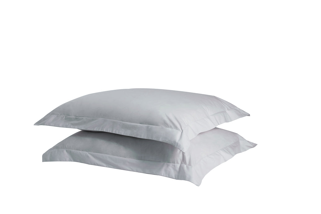 A set of two twill weave cotton pillowcases in various colors, showcasing their soft texture and durability.