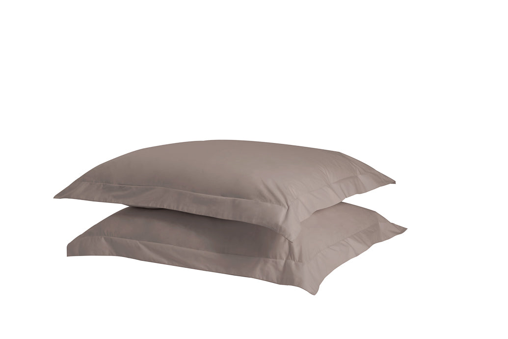 A set of two twill weave cotton pillowcases in various colors, showcasing their soft texture and durability.