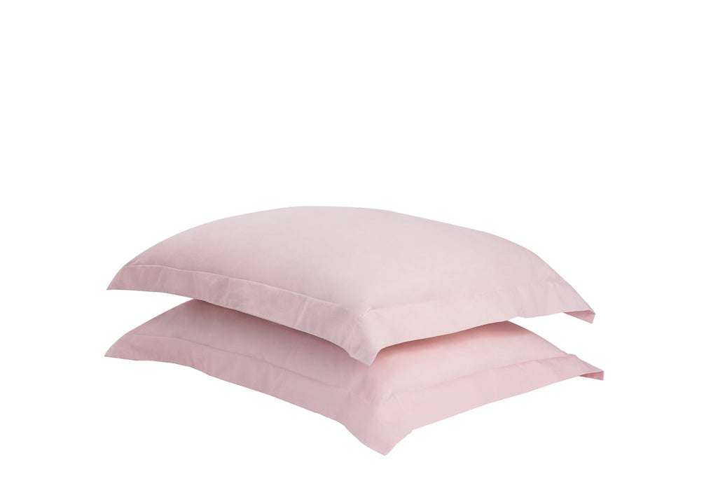 A set of two twill weave cotton pillowcases in various colors, showcasing their soft texture and durability.