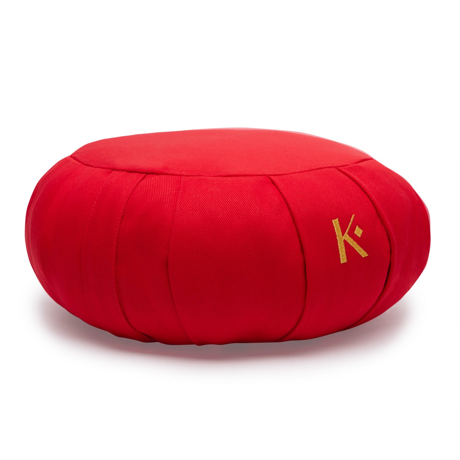 Zafu rond rouge en coton et kapok, coussin de méditation traditionnel, offrant confort et soutien pour la méditation et le yoga.