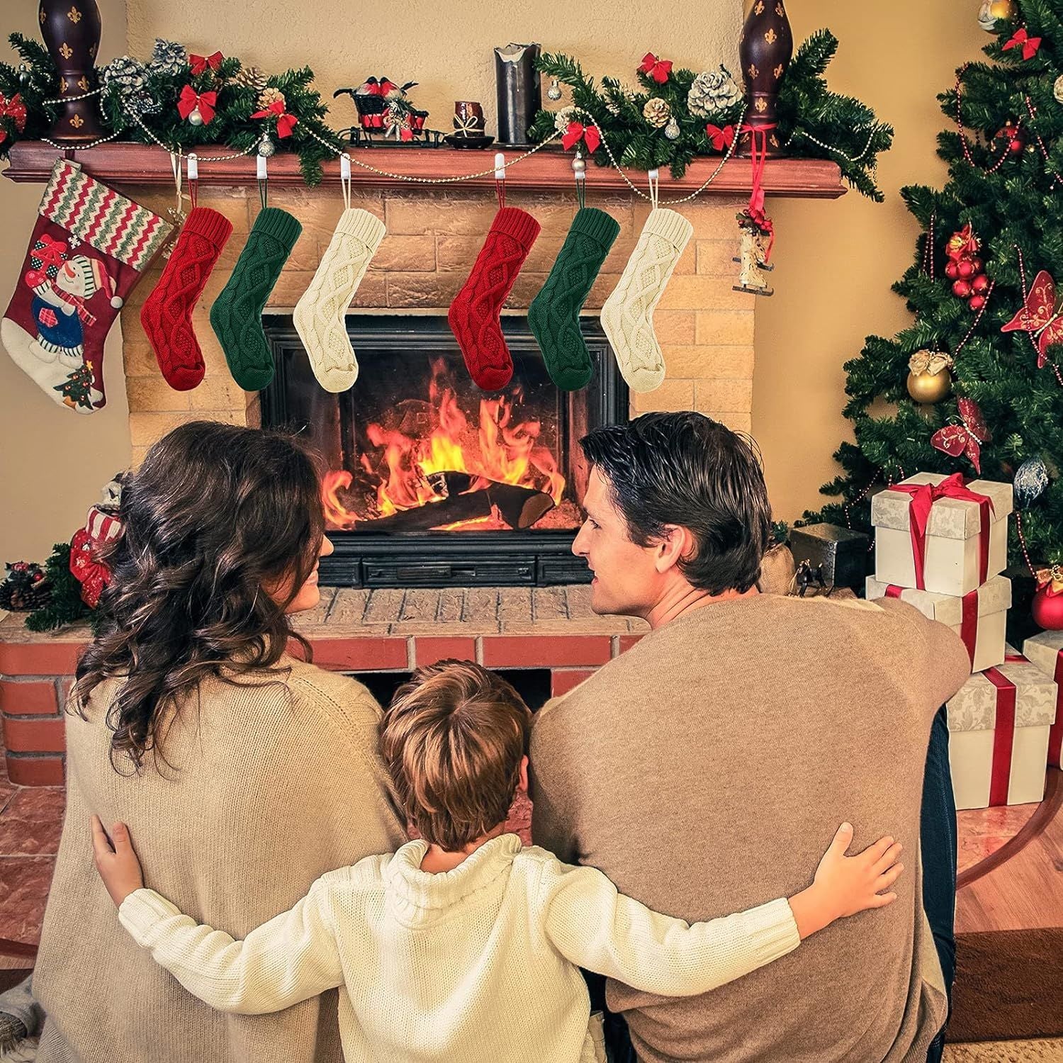 Three large knitted Christmas stockings in red, white, and green, each measuring 18 inches, displayed with festive patterns and hanging loops.