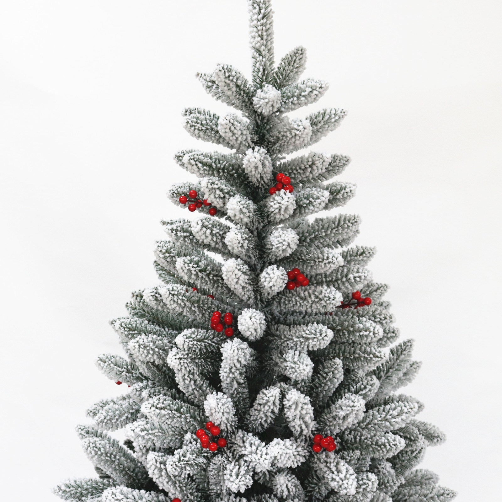 A beautifully flocked 7.5ft Christmas tree with 1500 tips, featuring a sturdy foldable metal stand, perfect for holiday decorations.