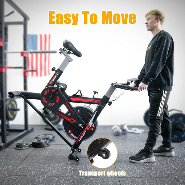 Exercise stationary bike with a 330 lbs weight capacity, featuring adjustable seat and handlebars, digital monitor, and transportation wheels for easy mobility.