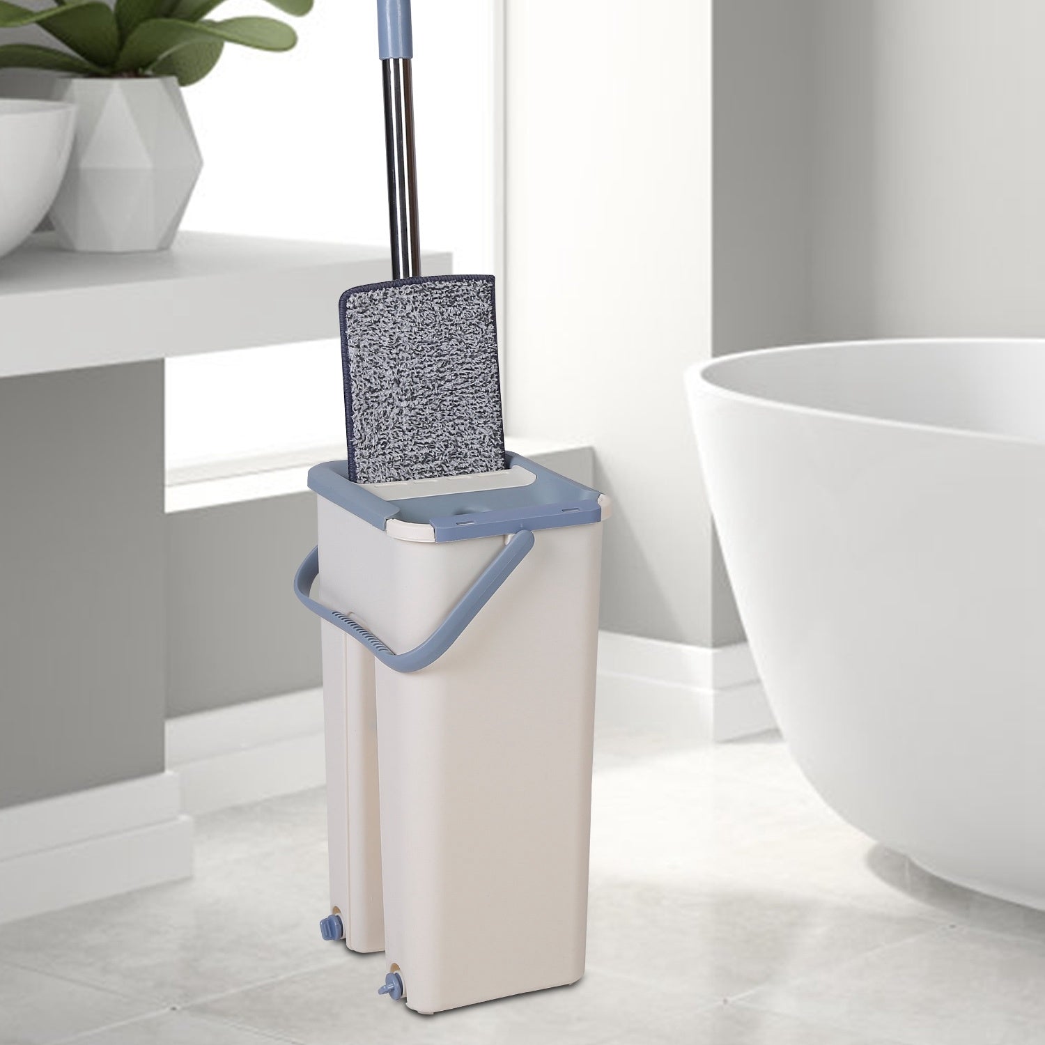 Flat Floor Mop Bucket Set featuring a 360-degree rotatable mop head, a dry and wet use bucket, and two microfiber mop pads, ideal for various smooth floor surfaces.