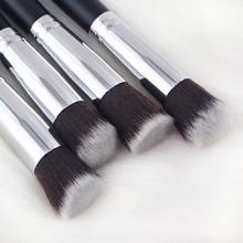 Mini Makeup Brushes Set for Travel featuring 10 professional brushes in a chic black design with golden accents and wooden handles.