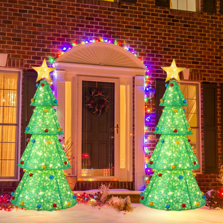 A beautifully decorated 6.5 ft Pop-Up Christmas Tree with 200 warm white LED lights, featuring snowflake patterns and colorful nylon balls, set against a festive backdrop.