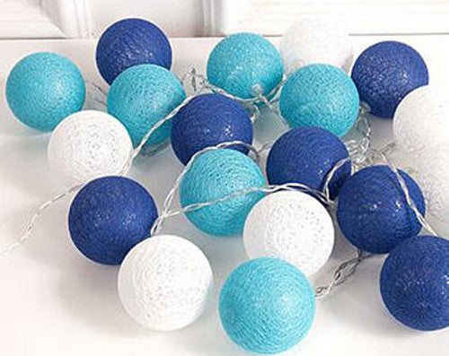 A set of 20 blue LED cotton ball string lights, showcasing vibrant blue colors and soft glowing bulbs, perfect for decoration.