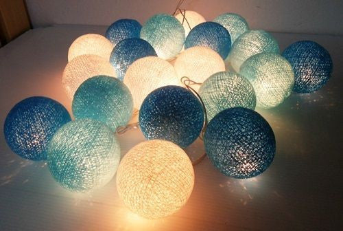 A set of 20 blue LED cotton ball string lights, showcasing vibrant blue colors and soft glowing bulbs, perfect for decoration.