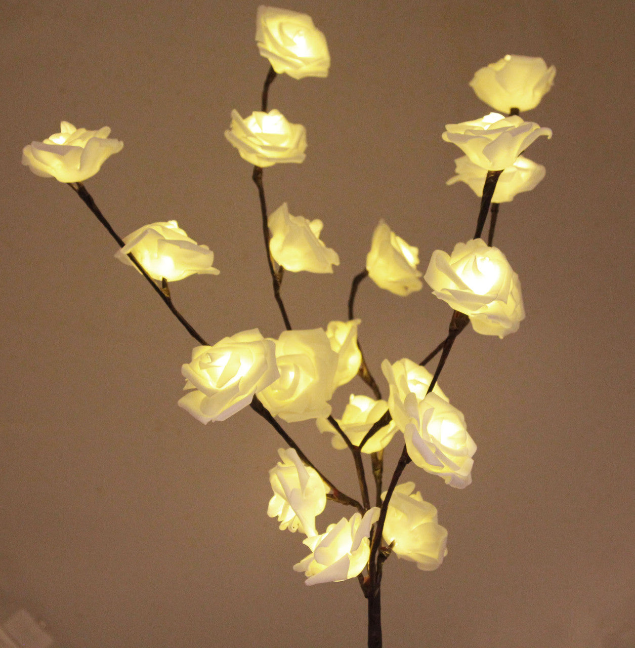 A beautiful 50cm high LED White Rose Tree Branch Fairy Light with 20 delicate white roses, perfect for weddings and home decor.