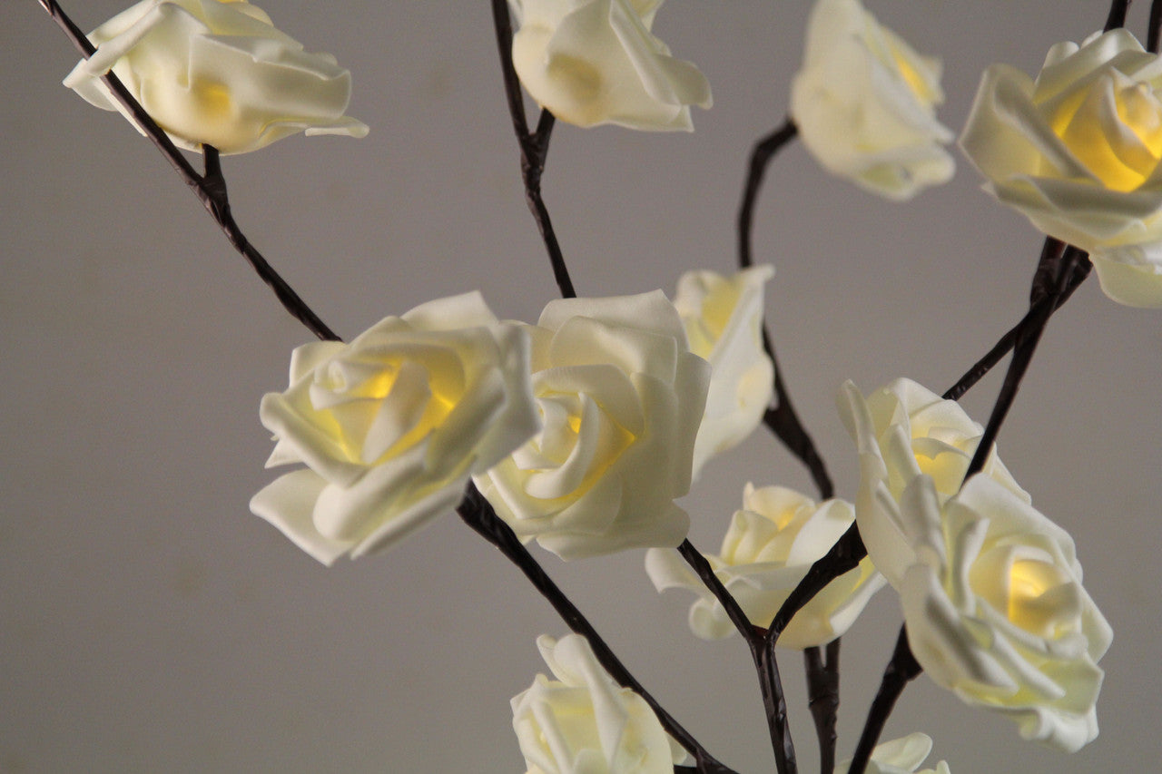 A beautiful 50cm high LED White Rose Tree Branch Fairy Light with 20 delicate white roses, perfect for weddings and home decor.