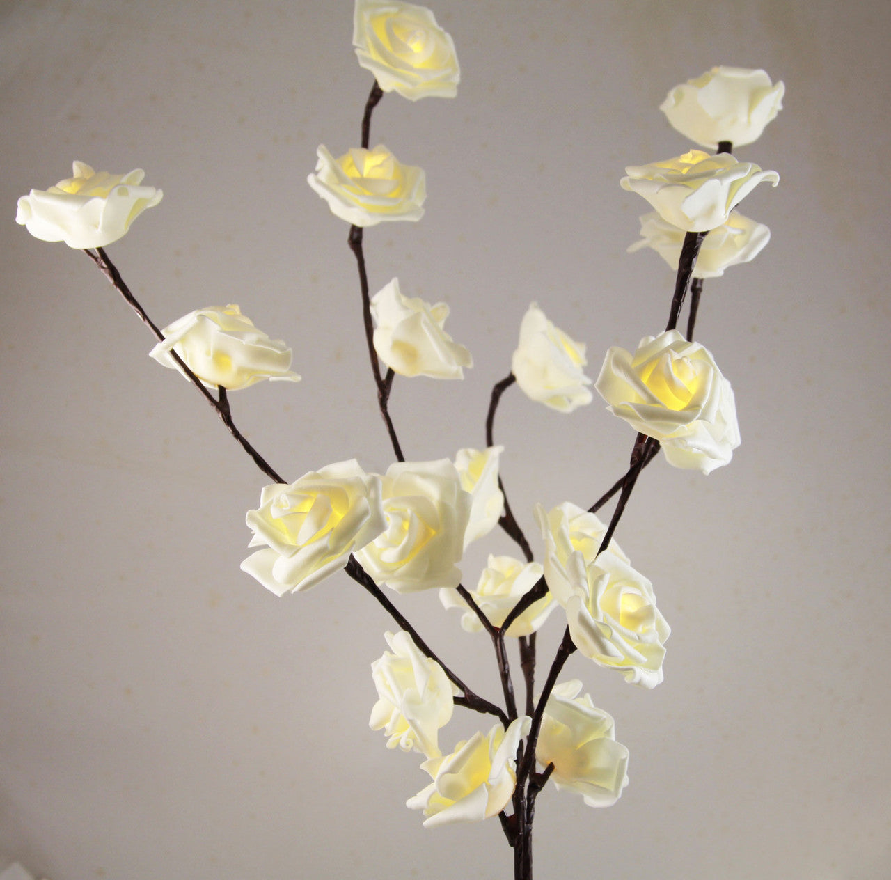 A beautiful 50cm high LED White Rose Tree Branch Fairy Light with 20 delicate white roses, perfect for weddings and home decor.