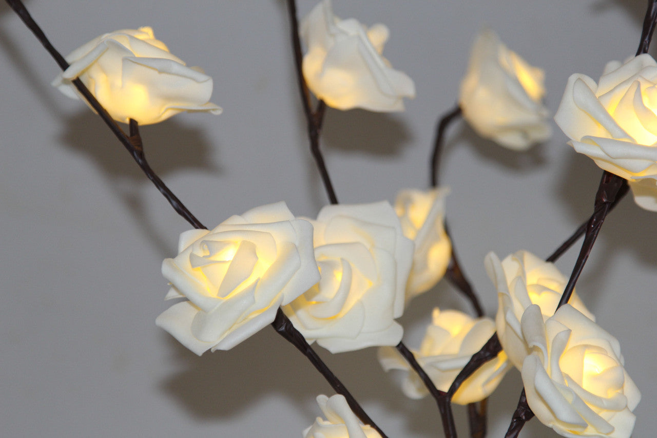 A beautiful 50cm high LED White Rose Tree Branch Fairy Light with 20 delicate white roses, perfect for weddings and home decor.