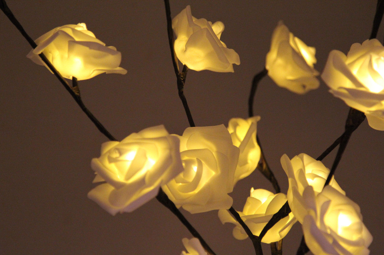 A beautiful 50cm high LED White Rose Tree Branch Fairy Light with 20 delicate white roses, perfect for weddings and home decor.