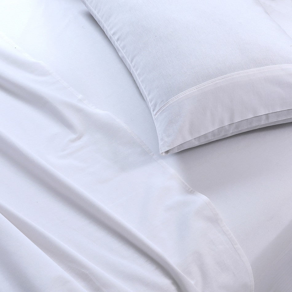 100% Egyptian Cotton Vintage Washed 500TC White Double Bed Sheets Set displayed on a bed, showcasing its luxurious texture and elegant design.