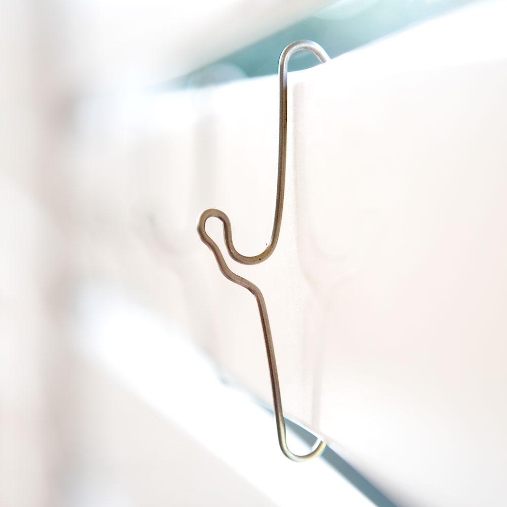 A pack of 10 stainless steel 70mm Brick Crab hooks designed for hanging items on brick walls without damage.