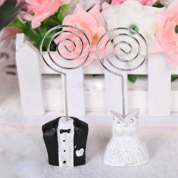 10 Pack of Bride and Groom Wedding Name Card Place Stands, featuring elegant dress and tuxedo designs.