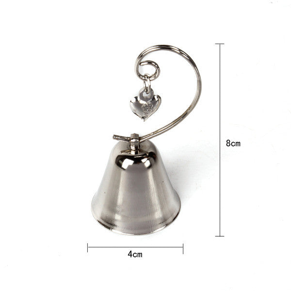 A set of 10 silver wedding kissing bells with heart name card holders, elegantly designed for table decorations.